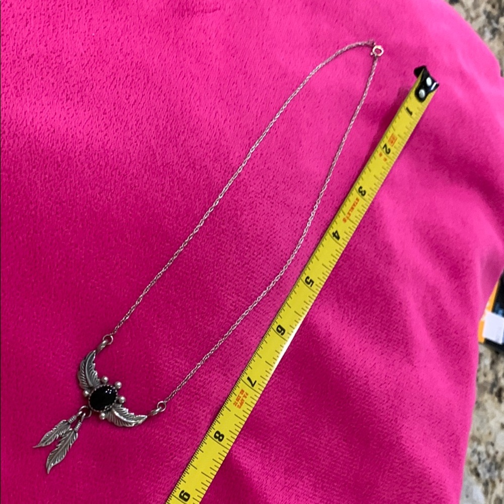 Stylish Sterling Silver Necklace with Black Stone and Feather Accents
